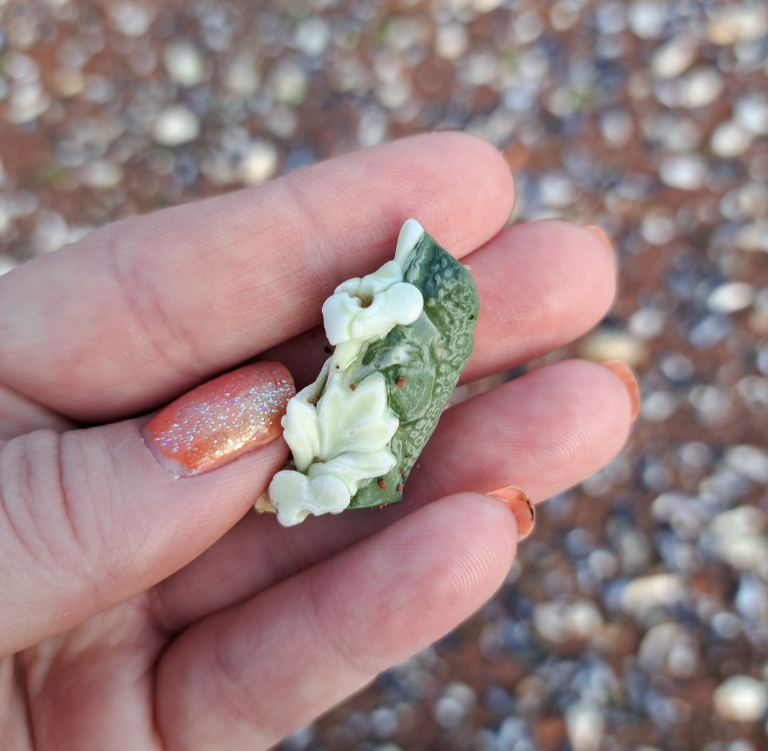 Green Pottery Fragment with White Floral Detail