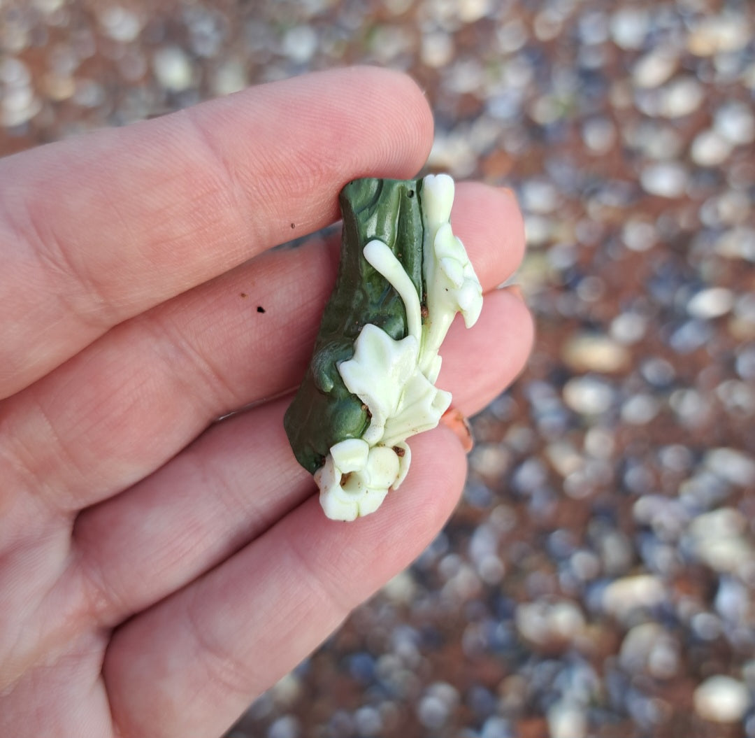 Green Pottery Fragment with White Floral Detail
