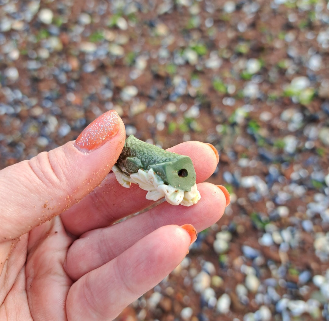 Green Pottery Fragment with White Floral Detail
